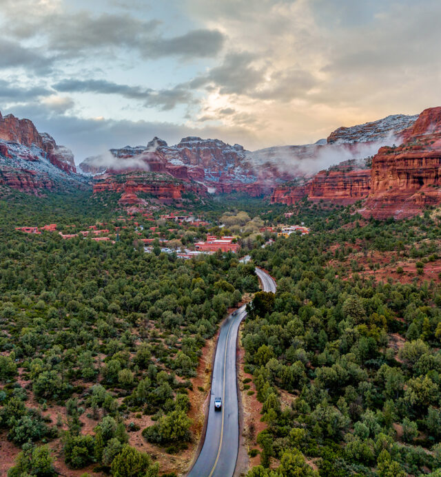Stormy Scene in Boynton Canyon with low hanging clouds over red rocks