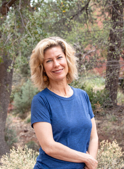 trail house female guide in blue shirt