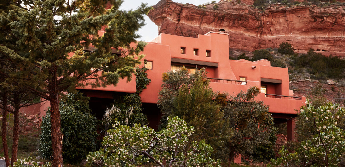 Red rock with casita in front and pine trees