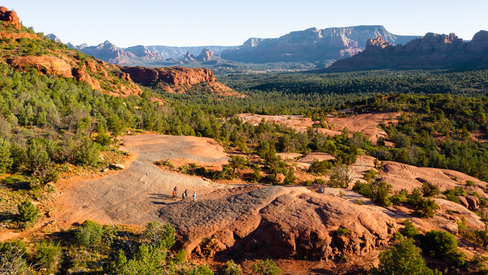 hikers on red rock trail in in Sedona