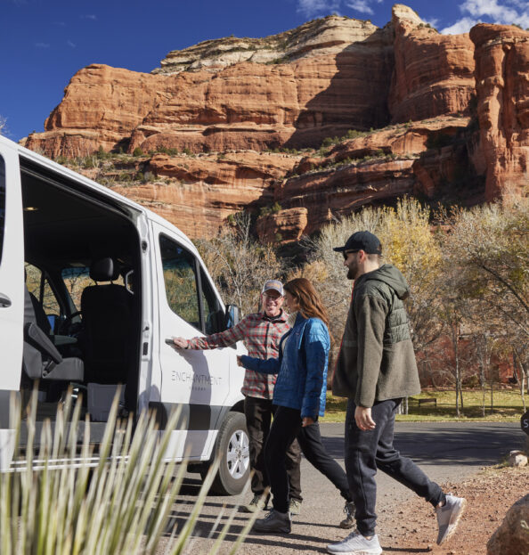 Driving Tours at Enchantment Resort, couple entering tour van with red rocks in background