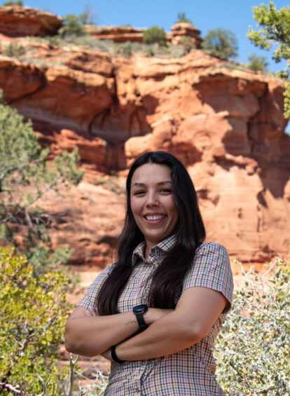 trail house female guide in blue shirt