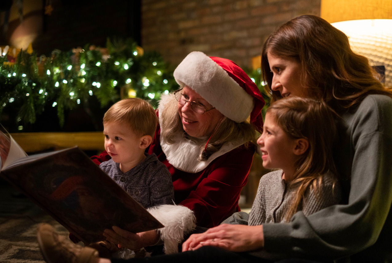 2 kids at storytime with mrs. claus