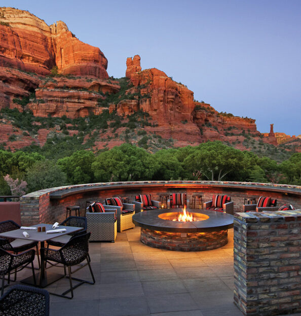 restaurant fire pit with chair and red rock views