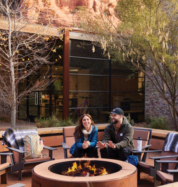 two guests enjoying the Trail House Firepit