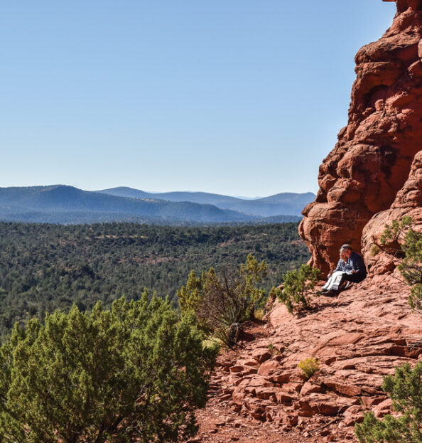 two hikers on trail overlook